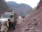 WFP truck driving through the rubble in the pakistani mountains