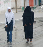 two women walking the streets of gaza