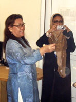 Gene Luna smiling in her office in Afghanistan